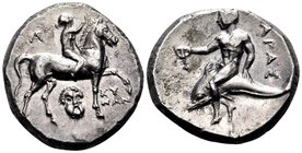 CALABRIA. Tarentum. Circa 272-240 BC. Nomos (Silver, 19.5 mm, 6.44 g, 3 h), Kynon. Nude youth riding horse walking to right, raising his right hand to...