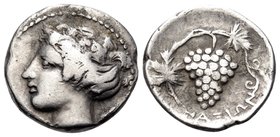 SICILY. Naxos. Circa 415-403 BC. Litra (Silver, 11 mm, 0.94 g, 5 h). Head of youthful Dionysos to left, wearing ivy wreath. Rev. ΝΑΧΙΩΝ Vine branch wi...