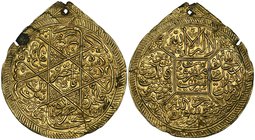 An Islamic gold-plated amulet, probably nineteenth century Iranian, with elaborate inscriptions on both sides, apparently made from two thin gold leav...