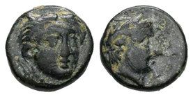 Aeolis. Larissa Phrikonis. AE 11. s. IV a.C. (Sng München-565). (Sng Cop-212). Anv.: Diosa a derecha. Rev.:  Cabeza laureada de Apolo a derecha. Ae. 1...