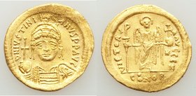 Justinian I the Great (AD 527-565). AV solidus (21mm, 4.39 gm, 6h). AU, graffiti, clipped, wavy flan. Constantinople, 7th officina. D N IVSTINI-ANVS P...