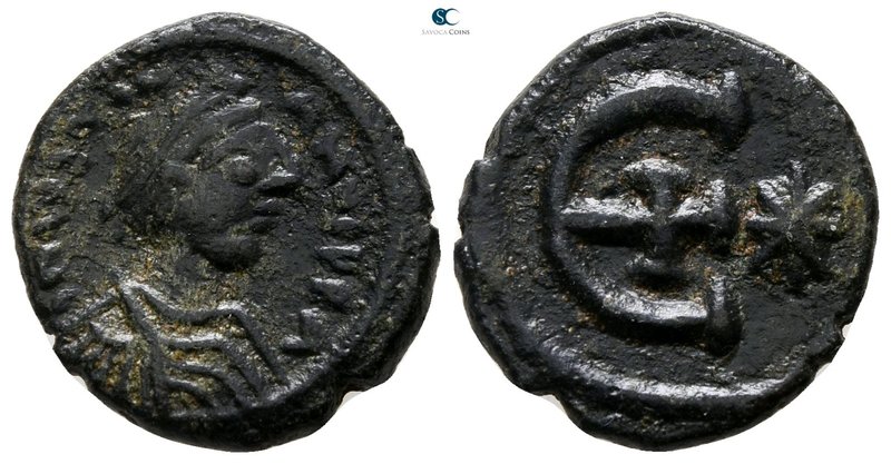 Justinian I AD 527-565. Theoupolis (Antioch)
Pentanummium Æ

15 mm., 2.59 g....