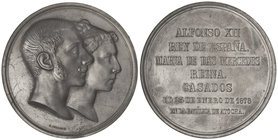 Medalla Boda Real. 23 Enero 1878. Anv.: Bustos sobrepuestos a derecha. Rev.: Leyenda en 7 líneas. Metal blanco. Ø 70 mm. Grabador: G. Sellán. V-476; V...