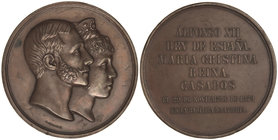 Medalla Boda Real Alfonso XII y María Cristina. 29 Noviembre 1879. Anv.: Bustos sobrepuestos a derecha. Rev.: Leyenda en 7 líneas. Br. Ø 71 mm. Grabad...