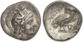 Apulia, Tarentum, Drachm, ca. 272-240 BC
AR (g 3,17; mm 15; h 4)
Head of Athena r., wearing Attic helmet, decorated with Scylla hurling stone, Rv. I...
