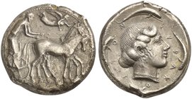 Sicily, Syracuse, Tetradrachm struck under the Second Democracy, ca. 460-450 BC
AR (g 16,3; mm 25; h 10)
Charioteer driving slow quadriga r.; holdin...