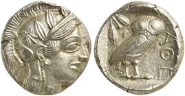Attica, Athens, Tetradrachm, after 449 BC
AR (g 16,87; mm 25; h 6)
Head of Athena r., wearing crested Attic helmet decorated with three olive leaves...