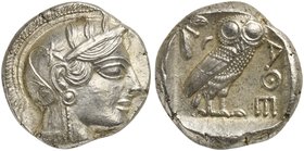Attica, Athens, Tetradrachm, after 449 BC
AR (g 17,03; mm 24; h 5)
Head of Athena r., wearing crested Attic helmet decorated with three olive leaves...