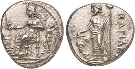 Cilicia, Nagidos, Stater, ca. 400-384 BC
AR (g 10,80; mm 24; h 3)
Aphrodite seated l., holding phiale over altar, decorated with a wreath; at r., Er...
