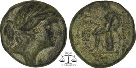 Seleukid Kingdom. Antiochos III ‘the Great’ (222-187 BC). Ae Laureate head right of Artemis. Apollo seated left on omphalos, holding arrow and resting...