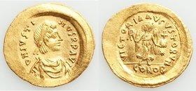 Justin I (AD 518-527). AV tremissis (17mm, 1.50 gm, 6h). AU, wavy flan. Constantinople, AD 518-527. D N IVSTI-NVS PP AVG, pearl-diademed, draped, and ...