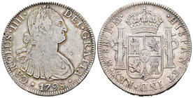 Carlos IV (1788-1808). 8 reales. 1798. México. FM. (Cal-692). Ag. 26,63 g. Pequeños defecto en el canto. MBC-. Est...60,00.