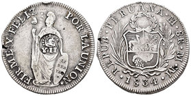 Isabel II (1833-1868). 1 peso. Manila. (Cal-451). Ag. 26,94 g. Resello de YII bajo corona en una pieza de 8 reales de Perú 1834. Golpes en canto y def...