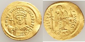 Justinian I the Great (AD 527-565). AV solidus (21mm, 4.48 gm, 6h). AU, scratch, graffito. Constantinople, 6th officina. D N IVSTINI-ANVS PP AVI, cuir...