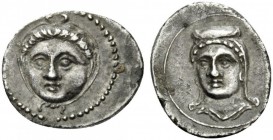 GREEK COINS 
 CILICIA 
 Uncertain. Circa 350 BC. Obol (Silver, 12mm, 0.81 g 10). Head of a gorgon facing, encircled by taenia tied at the bottom and...