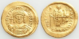 Justinian I the Great (AD 527-565). AV solidus (21mm, 4.52 gm, 6h). AU, wavy flan. Constantinople, 3rd officina. D N IVSTINI-ANVS PP AVG, cuirassed bu...