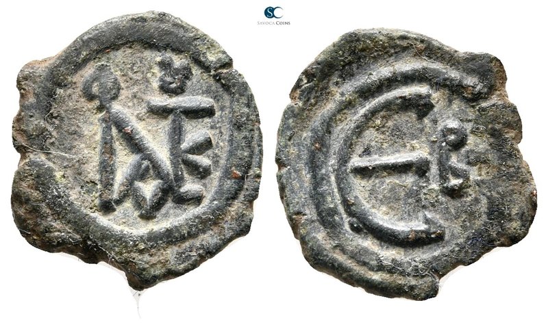 Justin II AD 565-578. Constantinople
Pentanummium Æ

16 mm., 1,52 g.



g...