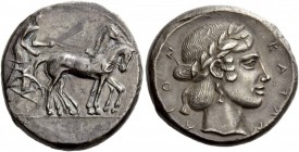 Greek Coins 
 Sicily, Catana. Tetradrachm circa 445 BC, AR 17.05 g. 
 Description Slow quadriga driven r. by charioteer, holding kentron and reins. ...
