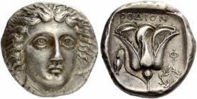 Greek Coins 
 Islands off Caria, Rhodes. Tetradrachm circa 404-385 BC, AR 15.28 g. 
 Description Facing head of Helios slightly r., hair in radiatin...