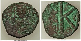 Constantine IV Pogonatus (AD 668-685). AE half follis (26mm, 6.98 gm, 7h). About VF. Constantinople, 1st officina, AD 673. Helmeted and cuirassed bust...