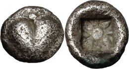 Africa. Cyrenaica, Cyrene. AR Hemiobol, c. 525-480 BC. D/ Silphium fruit. R/ Stellate pattern with central pellet; all within incuse square. BMC 34 va...
