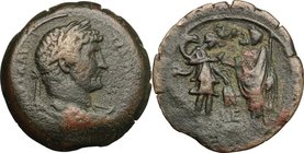 Hadrian (117-138). AE Drachm, Alexandria mint, 130-131 AD. D/ Laureate, draped and cuirassed bust right. R/ Hadrian standing left, holding sceptre, gr...