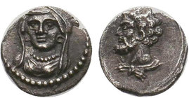 Veiled and draped bust of female facing slightly left / Head of Herakles left, with lion skin around neck. SNG Levante 220; Göktürk 40.
Diameter: 9mm...
