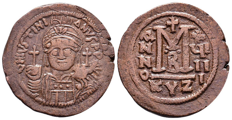 Justinian I, AE Follis. Cyzicus. 527-565 AD. DN IVSTINIANVS PP AVG, helmeted, cu...