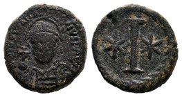 Justinian I, AE Decanummium, Rome. 527-565 AD. DN IVSTINIANVS P AVG, helmeted and cuirassed bust facing, holding cross on globe and shield / Large I, ...