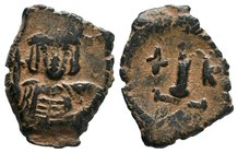 Constantine IV. 668-685 AD. AE Decanummium, Constantinople. No legend, helmeted, cuirassed, unbearded bust facing, holding cross on globe / Large I, c...