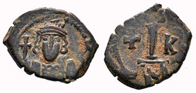 Constantine IV. 668-685 AD. AE Decanummium, Constantinople. No legend, helmeted, cuirassed, unbearded bust facing, holding cross on globe / Large I, c...