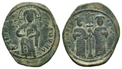 Constantine X, AE Follis, 1059-1067, Constantinople. +EMMA NOVHA, Christ standing facing on footstool, wearing nimbus and holding Gospels, IC XC acros...