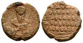 Lead seal of N. (uncertain) (ca 11th cent.), Obverse: Bust of a bishop saint, en face, nimbate, wearing bishop garments and omophorion, holding in his...
