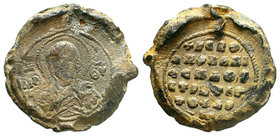 Lead seal of Apokapis Farmis(?), protospatharios and strategos (ca 12th cent.) Diam.: mm Weight: gr. Condition: F/VF. Attractive brown natural patina....