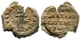 Lead seal of Symeon (?) eparchou (?) and in charge of ... (10th cent.) Diam.: mm Weight: gr. Condition: VF/F. Cracked alongside the channel. Light bro...
