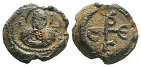 Lead seal of Sergios (7th cent.) Diam.: mm Weight: gr. Condition: F/VF. Attractive brown natural patina. Obverse: The bust Mother of God, en face, hol...
