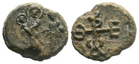 Lead seal of Theodoros (7th cent.) Diam.: mm Weight: gr. Condition: F/VF. Obverse: The Mother of God, en face, full-size, holding infant Jesus Christ ...