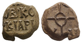 Lead seal of N. imperial kommerkiarios (8th/9th cent.) Diam.: mm Weight: gr. Condition: VF. Attractive brown natural patina. Obverse: Invocative cruci...