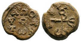 Lead seal of George honorary hypatos (7th cent.) Diam.: mm Weight: gr. Condition: VF. Attractive brown natural patina. Obverse: Cruciform monogram rea...