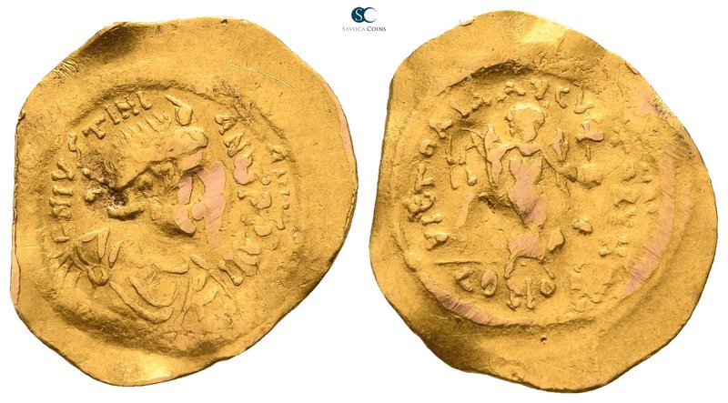 Justinian I AD 527-565. Constantinople
Tremissis AV

18mm., 1,43g.

D N IVS...