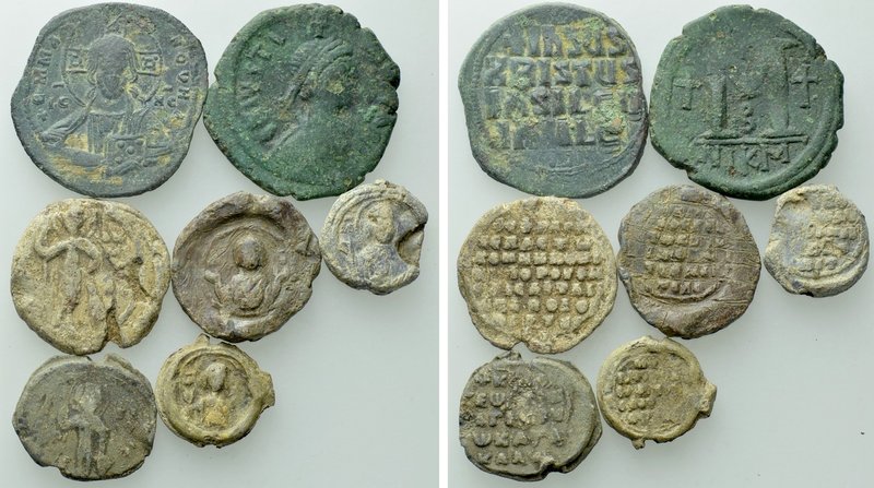 7 Byzantine Seals and Coins. 

Obv: .
Rev: .

. 

Condition: See picture....
