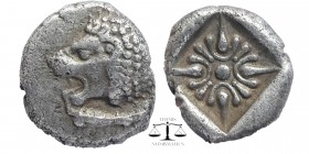 IONIA, Miletos. Late 6th-early 5th century BC. AR Obol. Hemihekte
orepart of lion right, head reverted / Stellate pattern within incuse square. SNG K...