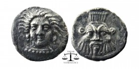 CILICIA, Uncertain. 4th century BC. AR Obol.
Female head (Arethusa?) facing. slightly left
Facing head of Bes.
Göktürk 44; SNG France 486; SNG Leva...