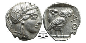Attica, Athens. AR Tetradrachm, c. 454-404 BC. 
Helmeted head of Athena right, with frontal eye. 
AΘE. Owl standing right, head facing; olive sprig an...