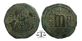 Maurice Tiberius. 582-602. AE Follis.
blundered legend, bust facing, wearing crown with trefoil ornament, and consular robes; in right hand, mappa, in...