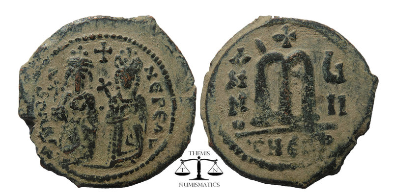 Phocas. 602-610. AE follis 
Phocas on left and Leontia on right, standing facing...