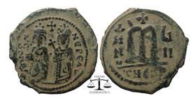 Phocas. 602-610. AE follis 
Phocas on left and Leontia on right, standing facing; he holds a globus cruciger while she holds a cruciform scepter, cros...