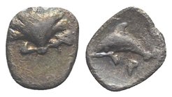 Southern Apulia, Tarentum, c. 325-280 BC. AR Hemilitron (7mm, 0.32g, 10h). Shell. R/ Dolphin leaping swimming l.; P below. Vlasto 1561; HNItaly 980. T...