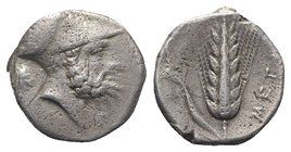 Southern Lucania, Metapontion, c. 340-330 BC. AR Stater (18mm, 7.73g, 3h). Helmeted head of Leukippos r.; to l., lion head r. R/ Barley ear with leaf ...