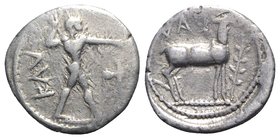 Bruttium, Kaulonia, c. 475-425 BC. AR Drachm (14mm, 2.30g, 6h). Apollo advancing r., holding branch; small daimon running r. on Apollo's l. arm; to r....